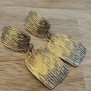 Gold Toned Textured Dangle Clip On Earrings